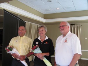 Terry Walker, left, Terri Matchett, both from Ball Foundation board of directors, and Richard Armstrong, Camp Crosley YMCA director, with the Distinguished Lake Tippecanoe Honoree Award presented at the annual meeting of the Lake Tippecanoe Property Owners Association Saturday, July 19, at Lake Tippecanoe Country Club.