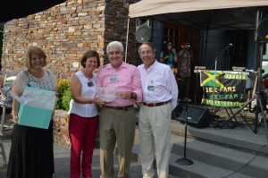 From left are Dr. Jerrilee Mosier, chancellor for the Ivy Tech Northeast region, Peggy and Bill Salin and Tom Snyder, president of Ivy Tech. The Salins were presented a crystal bowl by Snyder as a gift in appreciation for their hosting an event for Ivy Tech at their Lake Wawasee home.