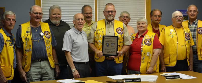 The Milford Town Council presented the Milford Lions Club with a plaque recognizing the group’s 70 years of service to the community. Pictured from left are Lions Club members Steve Weisser and Jerry Bethel; Town Council Members Dan Cochran, Bob Cockburn and Doug Ruch; Lions President Tom Sorensen; and Lions members Dennis Pinkerton, Barb Zimmerman, Steve Haab, Ron Marquart and Fred Weisser. (Photo by Keith Knepp)