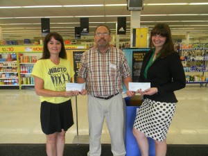 From left are Tracy May, coordinator of Wawasee High School’s ECO Challenge; Dale Kovarik, Shopko store manager; and Stacey Anderson, development manager with CAPS.