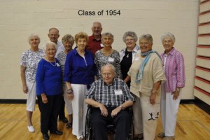 Pictured at their 60th high school reunion are members of the Manchester High School class of 1954. Pictured front and center is Jerry Purdy, distinguished alumni. In the first row behind him, from left to right, are: Ann Ambridge Kreider, Carol Tracy Haw, Cynthia Findley Stewart and German exchange student Karin Loeser Press. In the back row are: Sally Johnson Cosby, Wendell Dilling, Sue Lindzy England, Dick Holderman, Carolyn Schuler Eppley and Carol Moore Walker-Dick. (Photo provided)