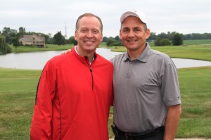 Crossroads League commissioner J.D. Collins golfed in the Grace Outing, taking time to pose with Grace College athletic director Chad Briscoe. (Photo by Josh Neuhart)