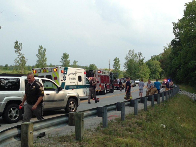 Police, fire and medics respond to the scene of a motorcycle accident south of Warsaw. (Photo by John Faulkner)