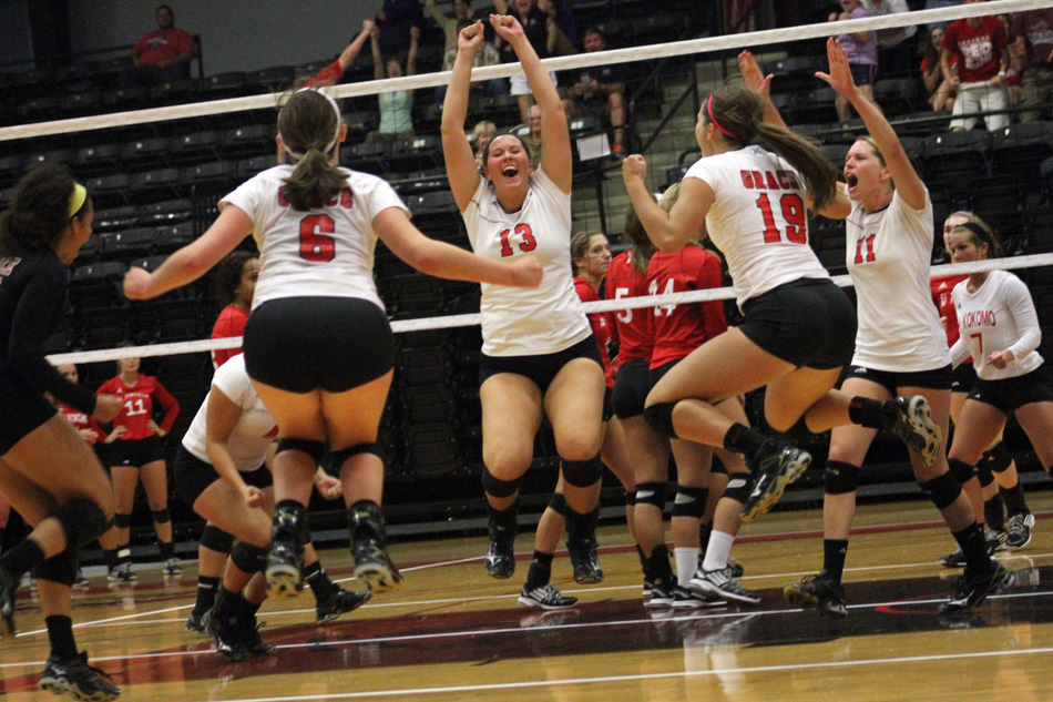 The Lady Lancers of Grace College celebrate a point Friday night in the Wyndham Classic volleyball tournament. (Photo provided by the Grace College Sports Information Department)