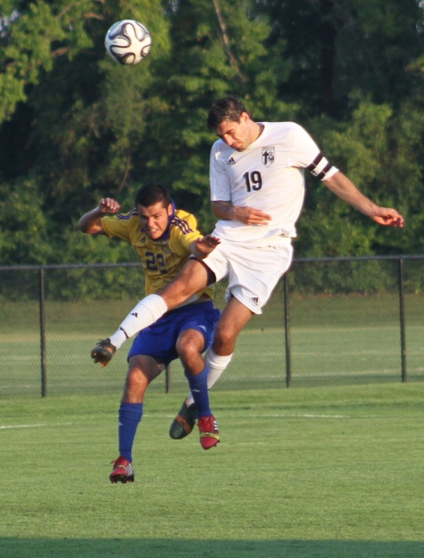 Justin Festa heads a ball for Grace Thursday night (Photo provided by Grace College Sports Information Department)