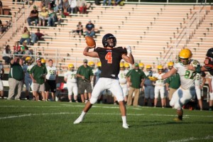 Riley Rhoades lets loose with a pass for the Tigers (Photo  by Ansel Hygema)