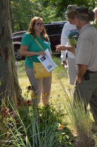 Joanne Moor, right, and Al Campbell talk with Mark Myers, right, about native plants he brought along to share or ideas he may have. (Photo by Deb Patterson)