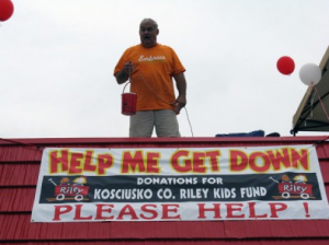 Jerry Nolin, owner of the Winona Lake Dairy Queen, is pictured here from his 2012 roof sit to raise money for Riley Childrens Hospital. Nolin is going on the roof again this year with an even larger goal.  Photo by Stacey Page)