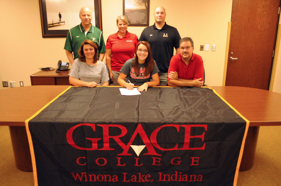Wawasee High School senior Paige Hlutke has signed a letter of intent to continue her softball career with Grace College. Seated with Paige are parents Jen and Glenn Hlutke. In the back row are Wawasee athletic director Steve Wiktorowski, Grace College softball head coach Heather Johnson and Wawasee softball head coach Jared Knipper. (Photo by Mike Deak)