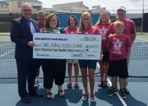A check for $1,237.78 was presented by Camille Kerlin, center, to the Kosciusko County Riley Kids Fund from the Racquets For Riley campaign held in July. Standing in the front row are Mike Bergen, co-founder of Kosciusko County Riley Kids Fund, Suzie Light, executive director of the Kosciusko County Community Foundation, Camille Kerlin, and Carson Kerlin. In the back row are Warsaw Community High School tennis coach Rick Orban, WCHS tennis assistant Jan Orban, Diane Kerlin and Rick Kerlin.