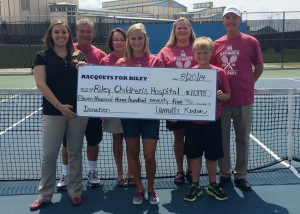 A check for $11,375 was presented by Camille Kerlin, center, to Riley Children's Foundation from the Racquets For Riley campaign held in July. Standing in the front row are Alana Helmer, representing Riley Children's Foundation, and Carson Kerlin. In the back row are Warsaw Community High School tennis coach Rick Orban, WCHS tennis assistant Jan Orban, Diane Kerlin and Rick Kerlin. (Photos by Mike Deak)