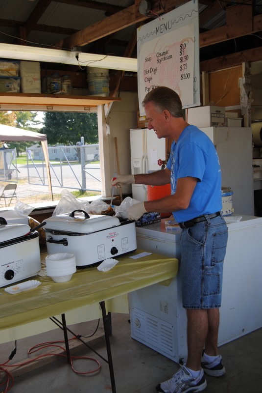 Richard Owen gets soup ready at today’s North Webster Heart of the Harvest Fall Festival. The chamber’s soup booth was busy as chamber members helped serve soup to hungry festival attendees.  (Photo by Phoebe Muthart)