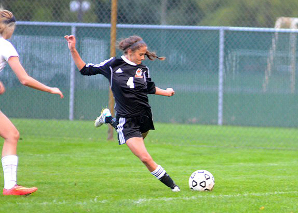 Clair Snodgrass of Warsaw sends a pass forward against Concord Thursday night.