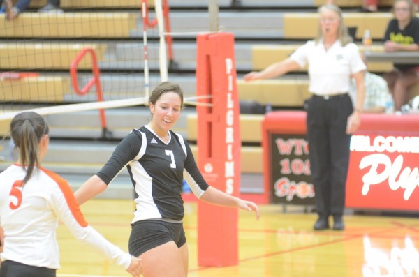 Celia Heckert is all smiles after a Warsaw point versus Plymouth.