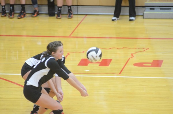 Caroline Mayer passes the ball for the Tigers.