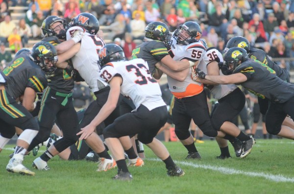Ross Armey eyes a Northridge running back. Armey had a huge blocked punt for the Tigers.