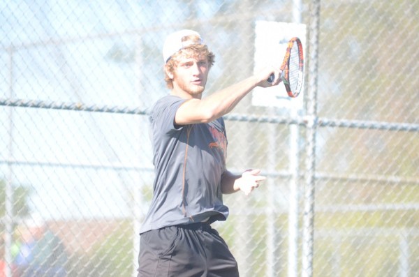 Sam Rice follows through for Warsaw Monday in NLC action at Concord. Rice rallied for a three-set win at No. 1 singles to held the Tigers clip Concord 4-1.