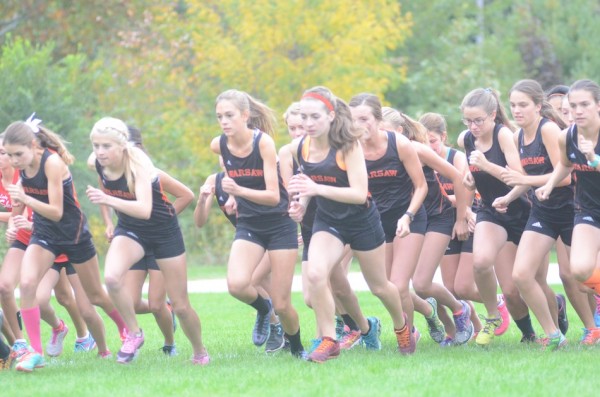 The Warsaw girls cross country team breaks from the starting line Tuesday. The No. 7 Tigers completed an undefeated conference season with wins over Goshen and Elkhart Memorial at Shanklin Park in Goshen.