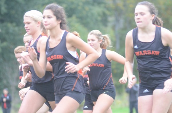Warsaw runners take off early in Tuesday's race in Goshen.