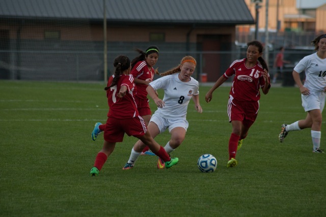 Brooklyn Jackson makes her way past a pair of Goshen defenders.