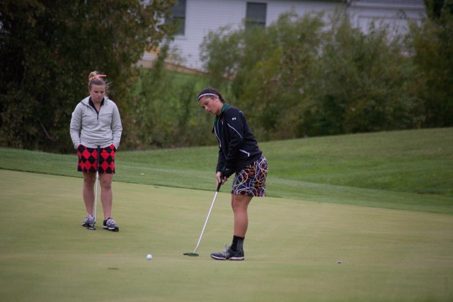 Page Desenberg follows a putt Thursday for the Tigers at Stonehenge.