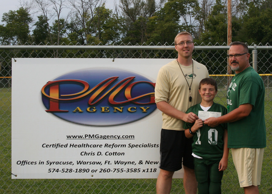 Wawasee Pee Wee Football receives a donation from the PMG Agency.