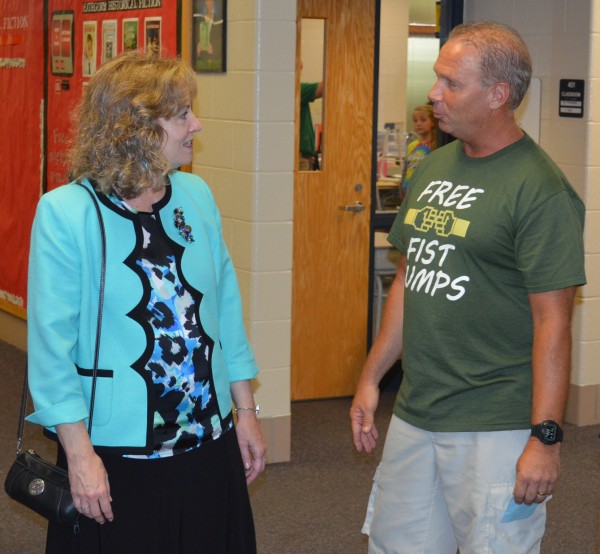 Glenda Ritz, left, state superintendent of public instruction for Indiana, visited briefly with fifth-grade teacher Mitch Willaman in a hallway during her visit to North Webster Elementary School Thursday afternoon.