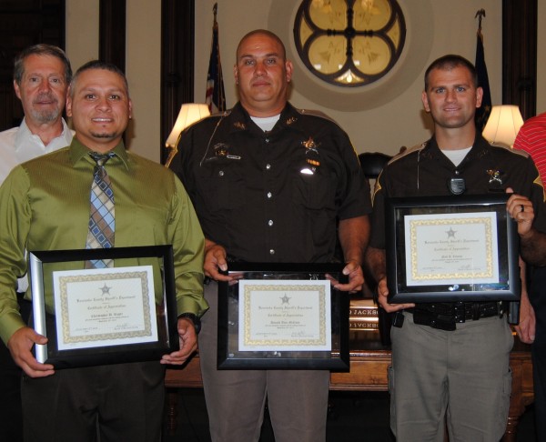 Three Kosciusko County sheriff’s deputies were honored at Tuesday’s county commissioners meeting in Warsaw. The officers were honored for two separate life-saving efforts Sept. 25, 2013, and Aug. 18. Pictured, from left, are Chris Rager, Don McCune and Neil Likens.