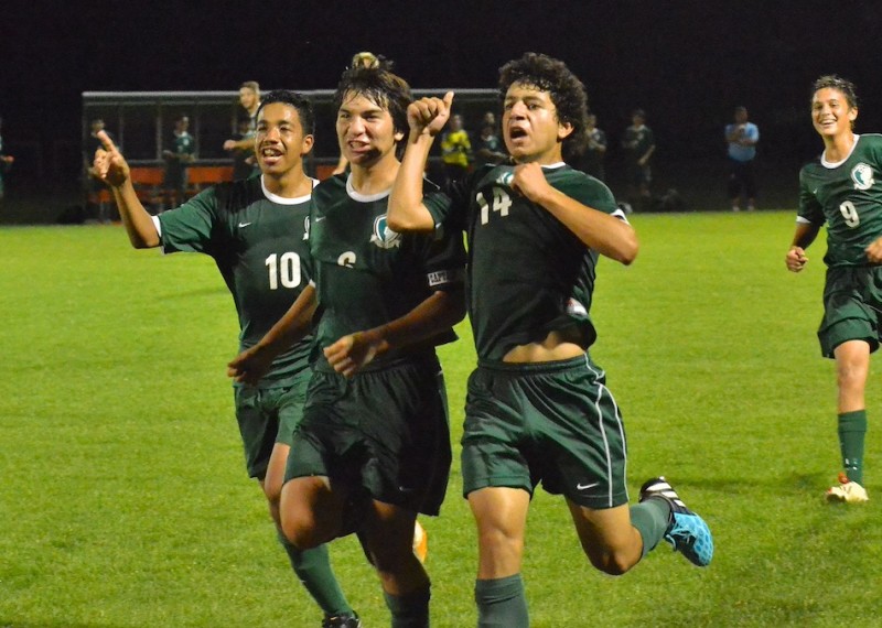 Christian Saleh (#14) runs towards the crowd with his teammates after scoring a goal in the final minute of Concord's shutout victory over Warsaw. (Photos by Nick Goralczyk)