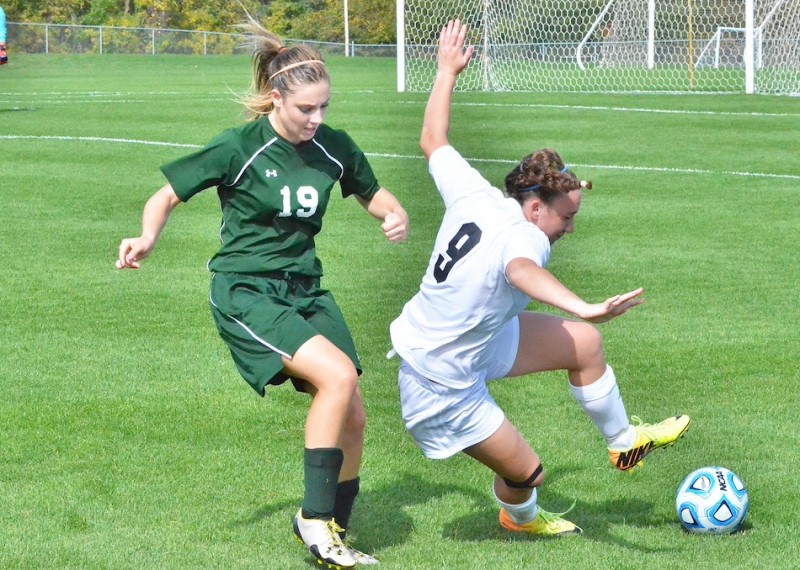 Leigh-Ann Schrack gets physical with Warsaw's Rachel McClelland.