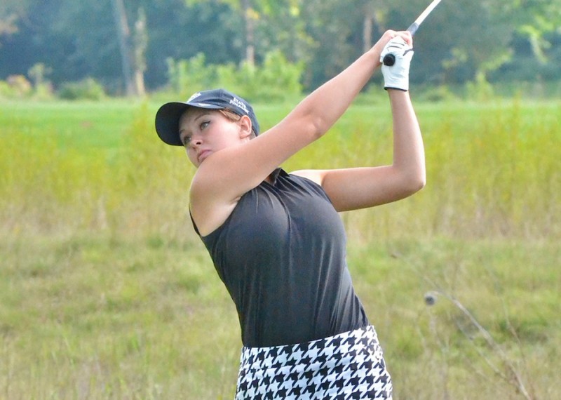 NorthWood senior Rachel Beebe checks out her drive on number one. (Photos by Nick Goralczyk)