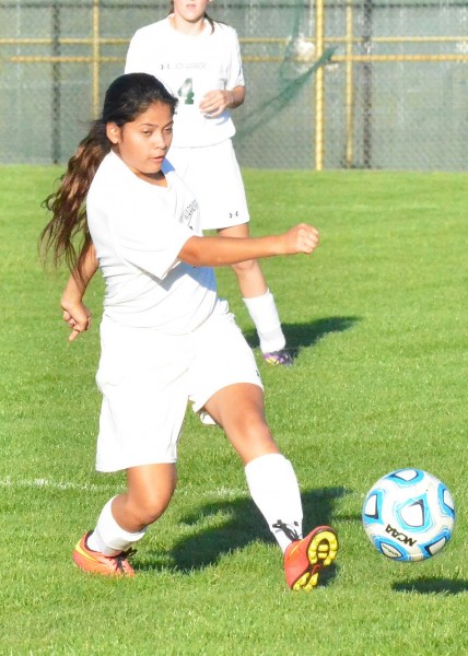 Samantha Valle works the ball up the field for the Lady Warriors.