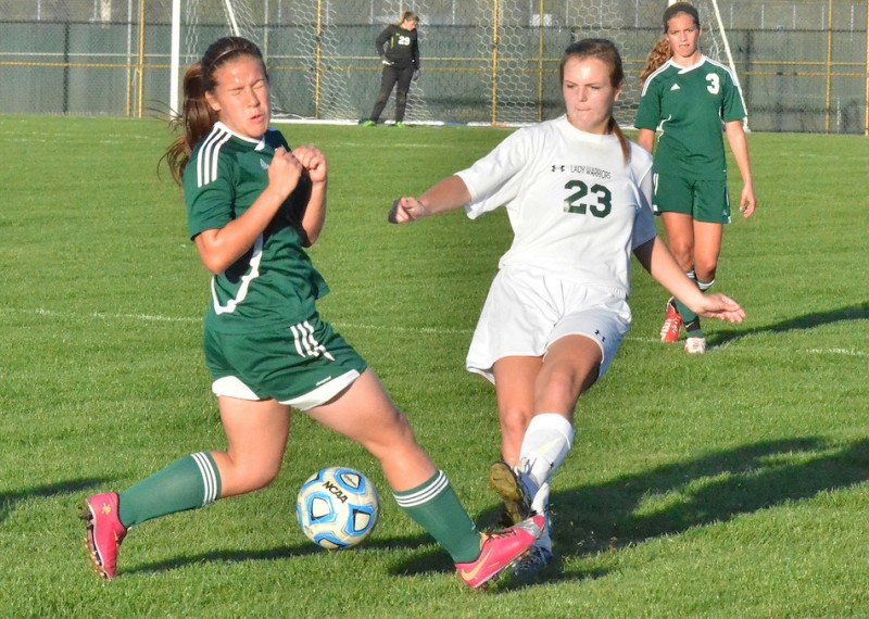 Savannah Schwartz squeaks a ball by a Northridge defender in second half action on Tuesday night. (Photos by Nick Goralczyk)