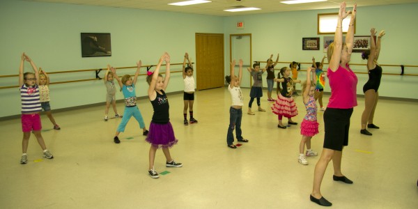 Pictured are Intro to Dance students with instructor Deb Collier.