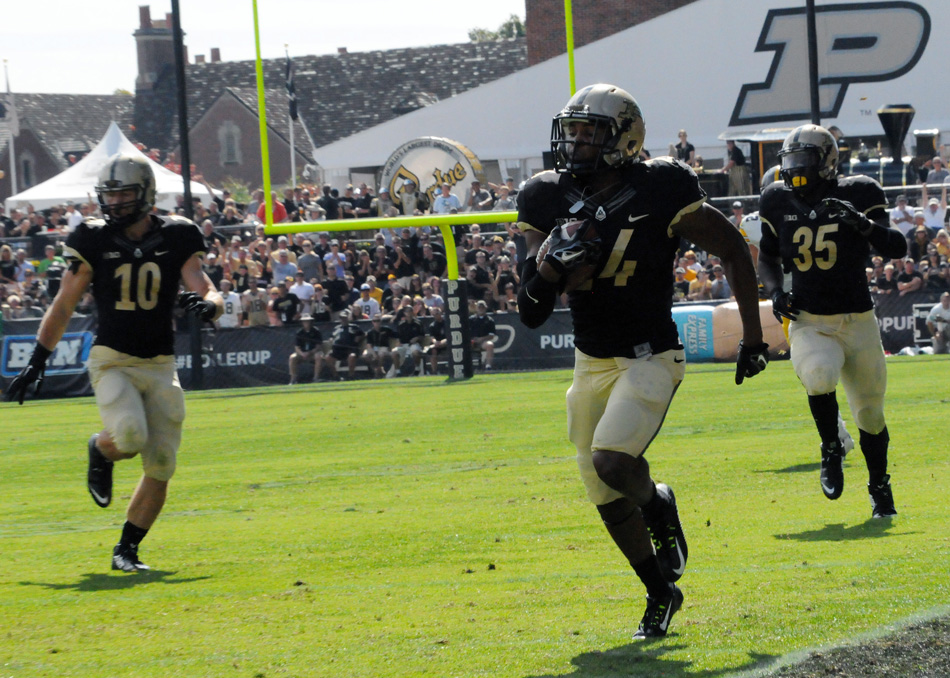 Purdue cornerback Frankie Williams returns an interception 39 yards for a touchdown against Iowa.