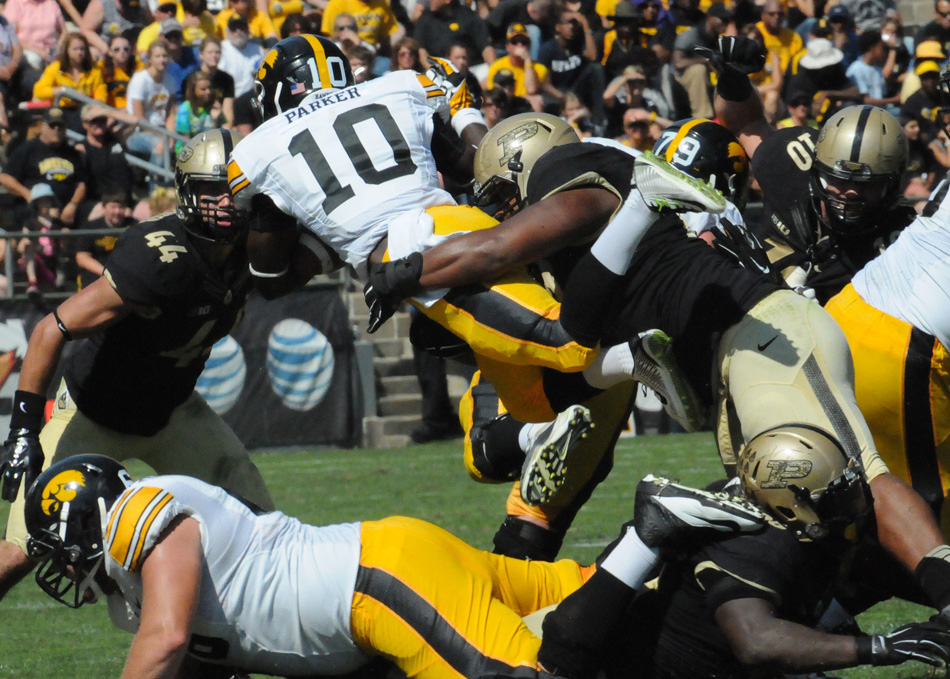 Iowa running back Jonathan Parker is swallowed up by the Purdue defense. Parker and the Hawkeyes would have the last laugh, rallying to beat Purdue 24-10 Saturday afternoon at Ross-Ade Stadium. (Photos by Dave Deak)