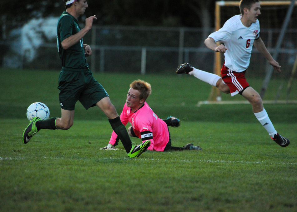 Wawasee goalkeeper Korey Knafel lays out to snuff out a shot attempt by Goshen's JT Plavchak.