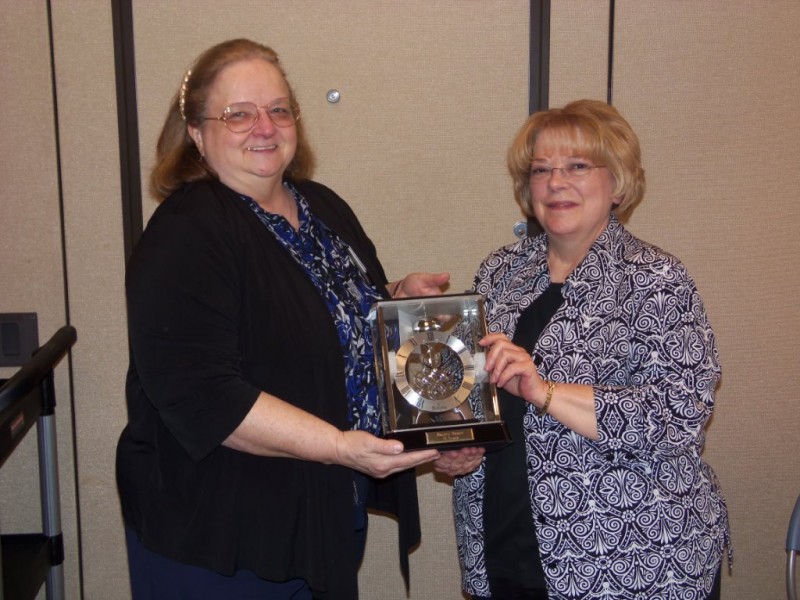 Sherry Sauer, Administrative Assistant at Kosciusko Home Care & Hospice, Inc. retires after 21 years of dedicated service. Dr. Emma Long, KHCH board vice-president presented a commemorative clock to her for her years of service. (Photo provided)