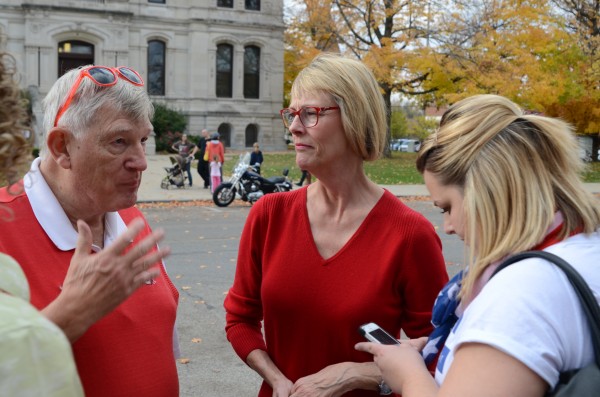 John Elliott talks with State Auditor Suzanne Crouch and Brittany McMurray, Crouch's campaign manager, during a stop in Warsaw. (Photo by Deb Patterson)