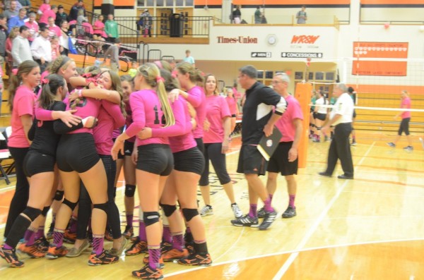 The Tigers celebrate after winning the NLC championship at home Thursday night.