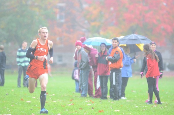 Owen Glogovsky was third overall to lead the Tigers to a title Saturday.