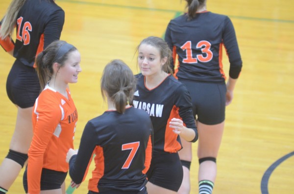 Warsaw players celebrate during sectional action.