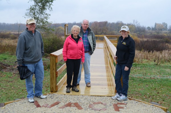 At the new overlook are Sam Lemen, WACF chairman, Barb and Doug Grant and Heather Harwood, WACF executive director. An informational board will be added to the location in the future. (Photo by Deb Patterson)