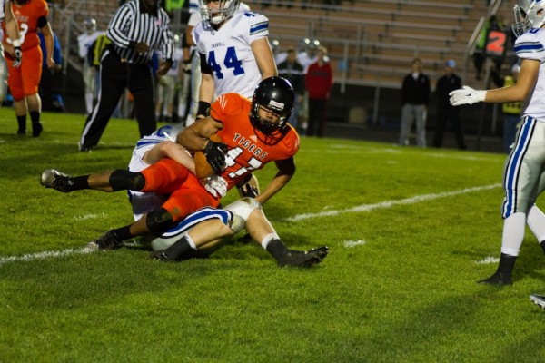 Jeremy David is tackled after a reception for the Tigers Friday night (Photos by Ansel Hygema)