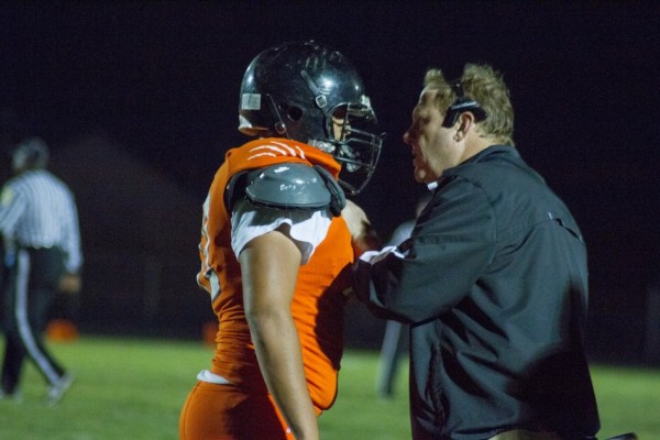 Warsaw coach Phil Jensen shares a few words of wisdom with a player Friday night.