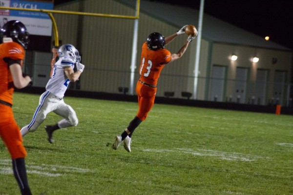 Receiver Brock Riley hauls in a pass for Warsaw.