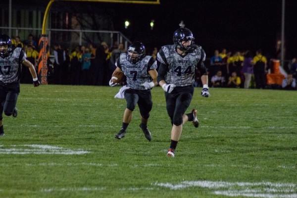 Ethyn Bradley returns an interception for Warsaw Friday night. The Tigers rallied to top Concord 24-21 in double overtime (Photo by Ansel Hygema)