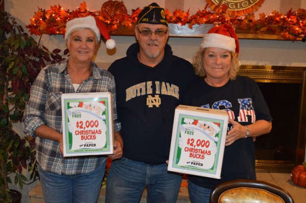 Jody Burkhart, left, Jeff Spickelmier (commander) and Candice Hine of the North Webster American Legion Post 253 are ready for the annual Christmas Bucks promotion. (Photo by Tim Ashley)