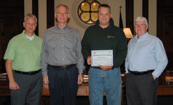 Chuck Dippon, an Army Ranger, was named October’s Veteran of the Month at the Kosciusko County Commissioners meeting Tuesday. Pictured, from left, are Veterans Service Officer Rich Maron, Commissioner Brad Jackson, Dippon, and Commissioner Bob Conley; Commissioner Ron Truex was not present.