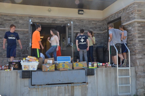 LCA students take a moment to process incoming donations.  (Photo by Alyssa Richardson)